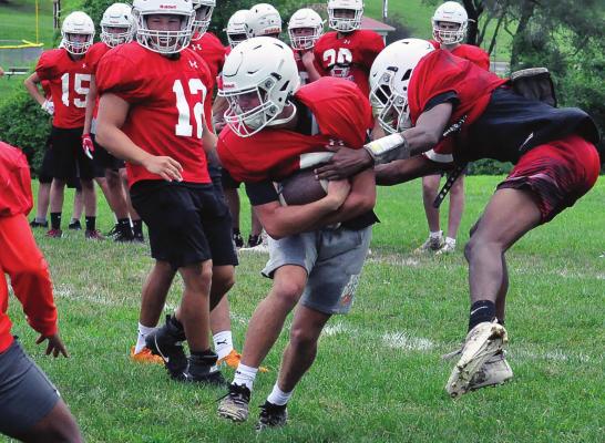 THE SPARTANS work on their running game, and on stopping the run, during their last week of team camp. SHAWN RONEY | Staff