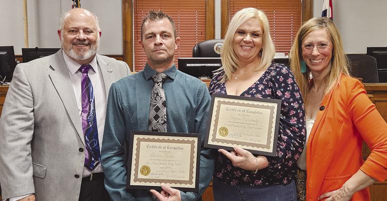 EIGHTH JUDICIAL CIRCUIT COURT JUDGE Kevin Walden (from left), Travis Sutton, Alicia McCullough and Ray County Prosecuting Attorney Camille Johnston celebrate after Sutton and McCullough graduate from the Drug Court program. MIRANDA JAMISON | Staff