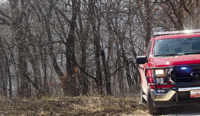 THE RICHMOND FIRE DEPARTMENT extinguishes a grass fire on Vandiver Road. Fire Chief Mark Sowder stated this was the fifth grass fire the department had responded to in just two days. MIRANDA JAMISON | Staff