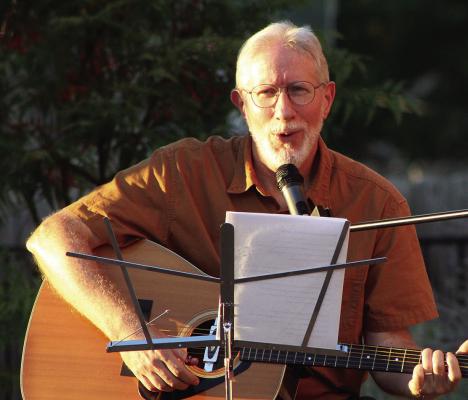 DAVE DONALDSON performs with guitar in hand as area musicians provide an evening of live entertainment. SHARON DONAT | Staff