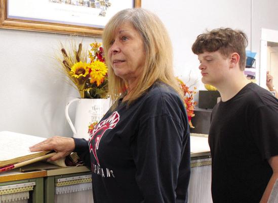RAY COUNTY RECORDER of Deeds Rhonda Kinnison (left) explains how deeds are recorded and filed to workforce math student Jonathan Calkins. Submitted