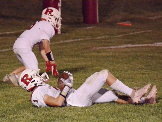 WITH TEAMMATE Logan Moyer behind him, Richmond first-year high schooler Dryden Hendrix lies in the end zone after making a second-quarter, touchdown-saving interception during the Spartans’ Sept. 29 victory at Carrollton. SHAWN RONEY | Staff