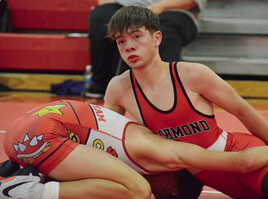 RICHMOND WRESTLER Liam Hyder (right) sprawls as he maintains control of his opponent during a scramble tournament match in Carrollton. At press time, Richmond was slated to host a summer scramble tournament Thursday. SHAWN RONEY | Staff