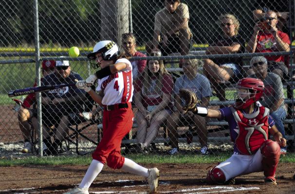 SYDNEY APPLEBERRY, shown swinging at a pitch in 2021, is taking on a different role on Richmond’s varsity softball team for her senior season because of a torn ACL and meniscus. SHAWN RONEY | Staff