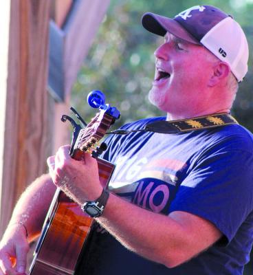 SHARON DONAT | Staff PASTOR PAUL GRANT sings to the crowd during the 816 Music Celebration.