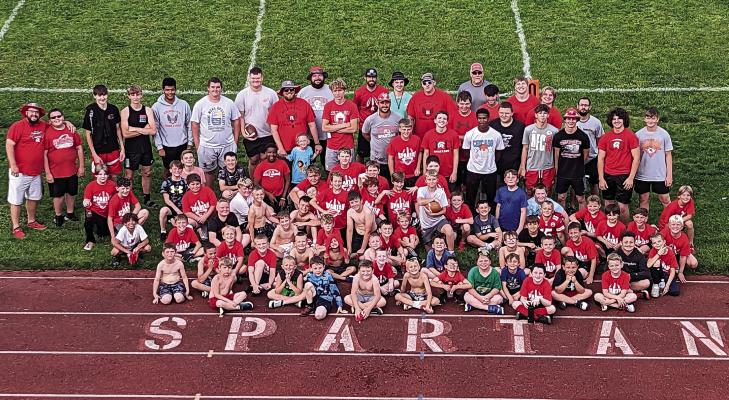 COACHES, STUDENT ASSISTANTS and campers gather near the north end zone at Spartan Stadium for a Richmond futures camp photo. COURTESY OF THE RHS FOOTBALL PROGRAM | Submitted