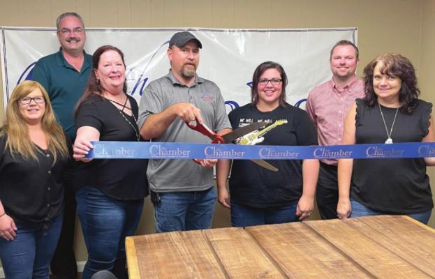 ATTENDING the Wisper Internet ribbon cutting July 15, from left, are Beth Smith; Brian Rice; Misti McKenzie; Damian Lemens, general manager; Mandi Tryon, marketing coordinator; James Gorham; and Carolyn Arney. EM RICE | Staff affiliate