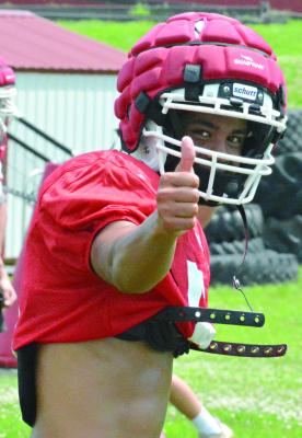 MALIKIAH THARP gives a thumbs up before running a pass route on the first day of Richmond’s prep football camp. SHAWN RONEY | Staff