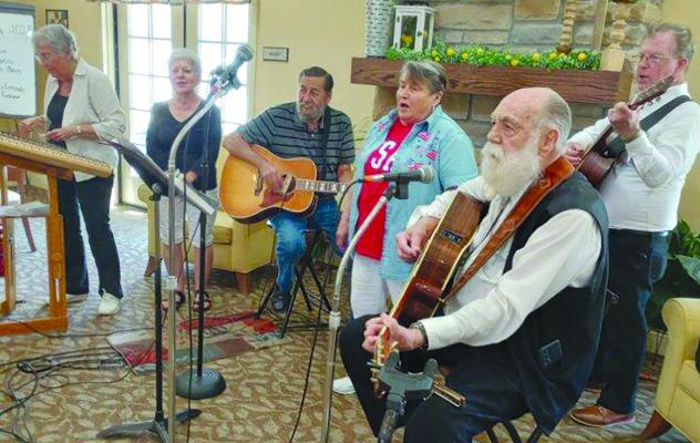 IVA DEHN, (from left), Mary Eddings, Walter Wiegand, Mary Kelton, David Simmons and Gene Suddarth finish the performance with “Amazing Grace”. DAVE DONALDSON | Staff