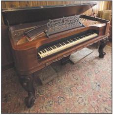 The Richmond Hotel was thriving in the 1800s, but it later burned down. The 1870s Knabe Square Grand Piano, which was recently tuned for use at local events, once belonged to the hotel, according to Ray County Museum Cathy Gottsch. SOPHIA BALES | Staff