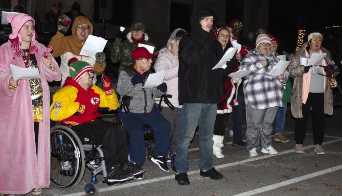 THE SNS CHOIR performs a variety of classic Christmas Carols before the lighted Christmas Parade. SHARON DONAT | Staff