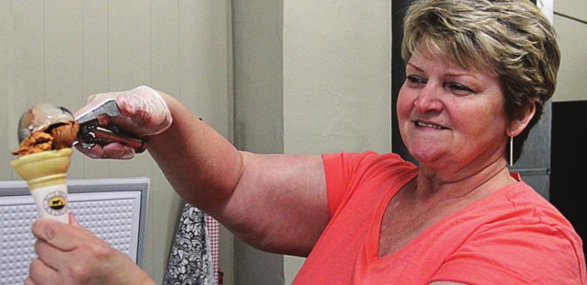 AN ICE CREAM cone comes together in the hands of Renee Kellerman at downtown Richmond’s newest store, Boothe 109.