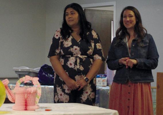 GABRIELA MEZA (LEFT) and Stephanie DeVeau, lactation counselors with Special Supplemental Nutrition Program for Women, Infants and Children (WIC) give a presentation about breastfeeding benefits at the community baby shower. SOPHIA BALES | Staff