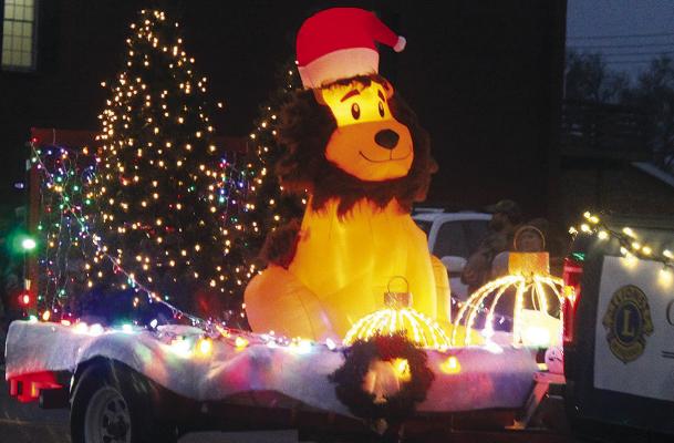 THE FESTIVE Orrick Lions Club float delights children along the parade route. SHARON DONAT | Staff