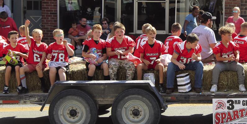 THIRD GRADE SPARTAN football players enjoy taking part in the parade. SHARON DONAT | Staff
