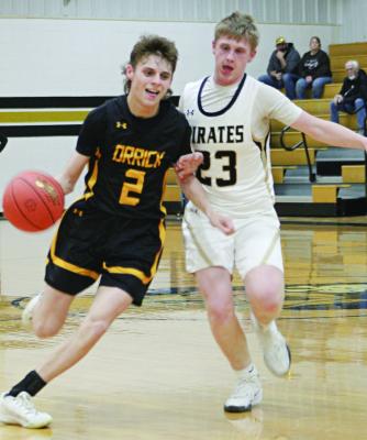 ORRICK SENIOR Logan Smith (left) dribbles during the Bearcats’ Class 1 District 13 Tournament opener with tournament host Norborne. The Bearcats sink the Pirates 82-26 to advance to the semis of the postseason single-elimination tournament. The Bearcats were scheduled to face Braymer Wednesday, with the Orrick and Hardin-Central girls set to open districts Tuesday.
