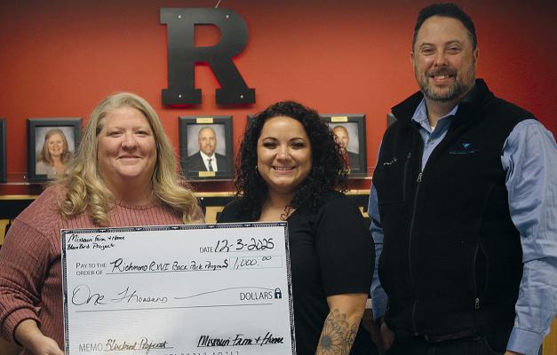 MISSOURI FARM AND HOME President and CEO Jimmy Carter (right) presents a $1,000 Bluebird Project donation to the Richmond School District staff Carrie Mueller (left) and Nicole Yoakum. SHARON DONAT | Staff