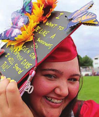 BRIANNA HOLTZCLAW shows off her decorated mortarboard during graduation in June 2020.