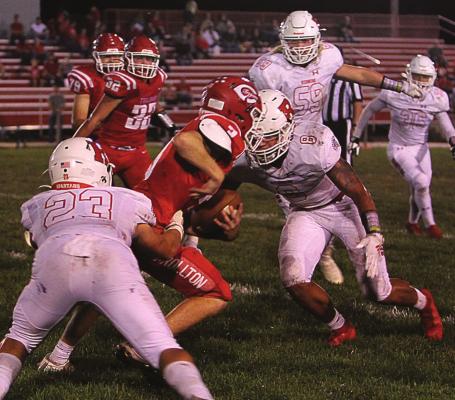 A WELCOME PART of Richmond’s game this year is defense. On this play, Carrollton sophomore quarterback Parker Minnick breaks to his right, arm back and ready to pass. But with Richmond senior linebacker Tanner Bennett in hot pusuit, Minnick cannot pass, so he cranks up the speed and runs toward the sideline where defenders, including Aiden Iveson and Keyshaun Elliott, slow him up to help bring him down. J.C. VENTIMIGLIA | Staff