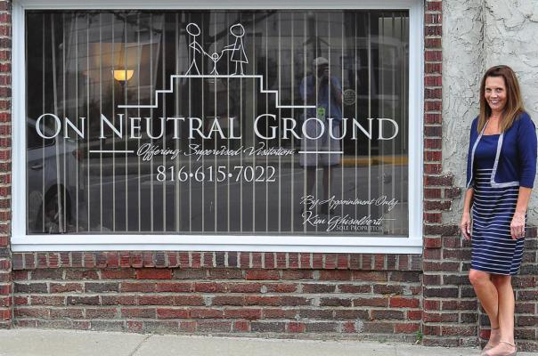 A PICTURE WINDOW with a picture that portrays the purpose of On Neutral Ground is shown off by the business owner, Kim Ghisalberti, Richmond. SHAWN RONEY | Staff