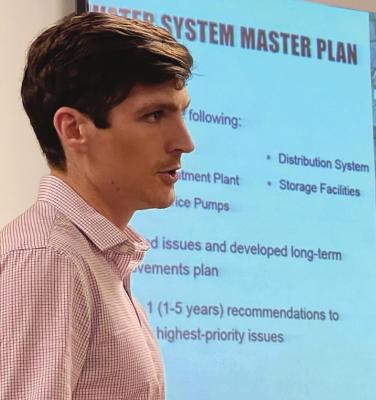 TAYLOR JERGENS, representing Olsson, shares a summary of water leaks with council members. BRIAN RICE | Staff