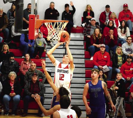 RICHMOND SOPHOMORE Gabe Johnson looks to bank in a short jumper Feb. 3 during the first half of the Spartans’ 78-19 courtwarming thumping of Holden in Missouri River Valley Conference East Division action. SHAWN RONEY | Staff