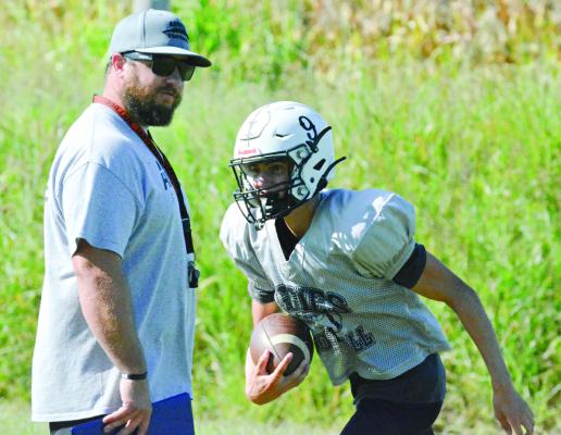 NORBORNE HARDIN-CENTRAL varsity 8-man football coach Andrew Watson (left), shown watching Brody Fifer during practice Tuesday at Hardin-Central, can add his first victory over Sweet Springs to his list of achievements. SHAWN RONEY | Staff