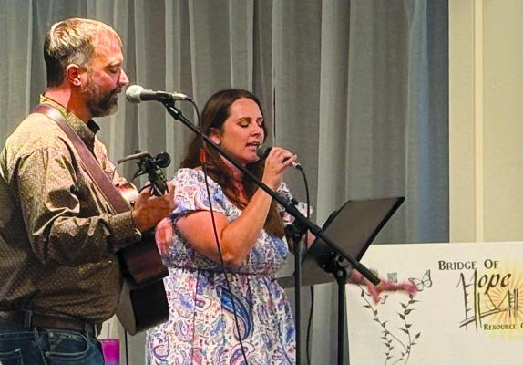 DREW AND KATIE GILL perform during the annual fundraising Bridge of Hope Gala. The event supports the non-profit’s mission to meet the needs of those facing the challenges of raising a family. DARROLL RUARK | Submitted