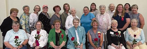 At a special meeting this summer, Beta Tau presented roses and honored long-time members Linda Cain (seated from left), Nancy Smith, Judy Salter, Claudetta McCorkendale, Opal Richardson, Mary Pettegrew and Joan Judd. Additionally, Joyce Barrett (standing from left), Dona Philips-Proffitt, Judy Waters, Lynette Morris, Roberta Stoenner, Lisa Thacker, Billie Hamann, Jayne Taylor, Kerri Prom, June Harrison, Maggie Presson, Amber Opfer, Joyce Sayegh and Brenda Hamm. Submitted