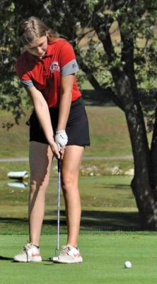 RICHMOND SENIOR Hannah Norris attempts a late-round putt during the Class 1 District Tournament Monday at Shirkey Golf Course.