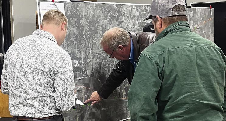 CMT SR. RAIL Planning Lead Eric Curtit view the display map with others. SOPHIA BALES | Staff
