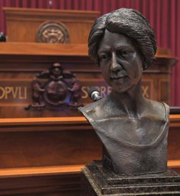 THIS BRONZE BUST of Annie White Baxter, the nation’s and Missouri’s first female county clerk, is viewed in the House chamber. The bust has since been placed on display in the Capitol Rotunda’s Hall of Famous Missourians. TIM BROMMEL | House Communications