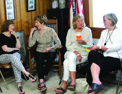NANCY GILBERT (from left) chats with Patti Bamman, Janet Annette and Valerie Miller at the Chamber After Hours.