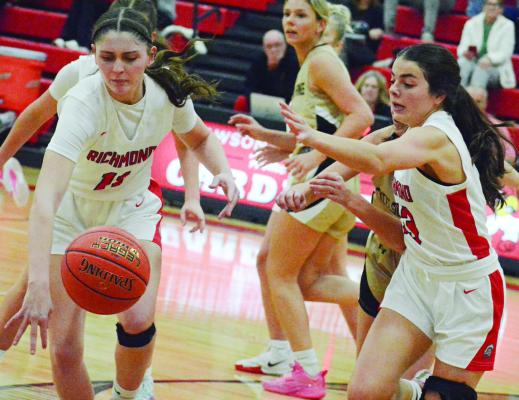 CANDIACE CLAYPOLE (left) and Genevieve Didier pursue a loose ball for Richmond in the Lawson Invitational. SHAWN RONEY | Staff