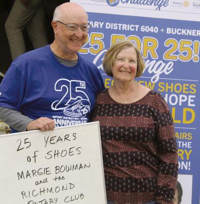ROTARY INTERNATIONAL President-nominee Larry Lunsford (left) recognizes Richmond Rotary Club member and longtime Shoes for Orphan Souls leader Margie Bowman for 25 years of involvement in the effort. SHARON DONAT | Staff