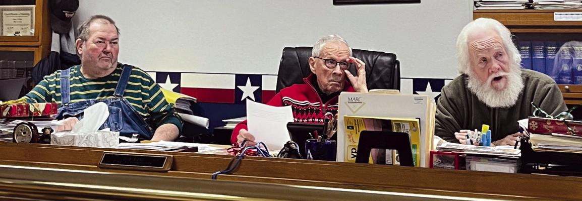 GARY WILHITE (from left), BOB KING and Dave Powell listen in as Pastor Willie Isaacson presents his ideas to the Ray County Commissioners. The pastor asks for requests and statements pertaining to Amendment 3 and the potential of microbusinesses opening in Ray County. SOPHIA BALES | Staff
