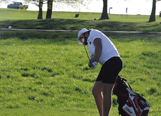SENIOR JACK GOGUE hits a chip shot during Richmond’s varsity boys golf dual with Odessa Monday at Shirkey Golf Course. SHAWN RONEY | Staff
