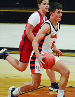 HARDIN-CENTRAL SENIOR Kameron Pugh drives the lane with the basketball against Northland Christian during the Bulldogs’ Nov. 17 season and home opener. SHAWN RONEY | Staff