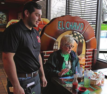 AT TEQUILA JALISCO, restaurant doors remain open and Heraldo Hacentio waits on Janis Kincaid during the pandemic. A few days later, all Ray County restaurants close to walk-in customers. J.C. VENTIMIGLIA | Staff