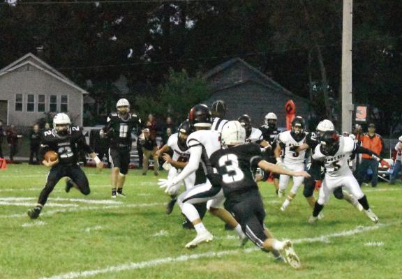 AGGIES QUARTERBACK Zach Deitch, No. 2, displays his running skills Sept. 23 at Hardin-Central on a night when he also throws for 200-plus yards. TARA ATLIS | Staff