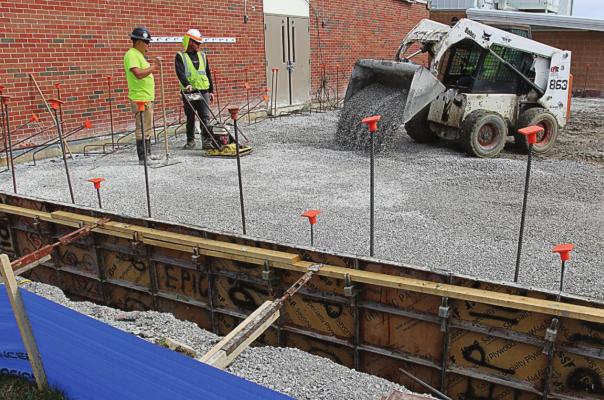 OUTDOOR WORK at Elkhorn Elementary School remains in progress last week as the floor is being poured. By Wednesday, walls begin to form. A grant for a disaster safe room lowers the school district’s construction costs. J.C. VENTIMIGLIA | Staff