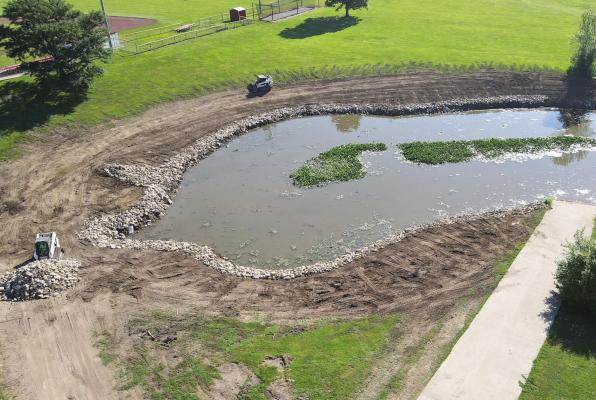 MACEY EXCAVATING can be seen grading Southview Lake’s bank and cleaning the area around the lake of underbrush and debris. Rip-rap rock is being placed around the shore to prevent erosion. BRIAN RICE | Publisher