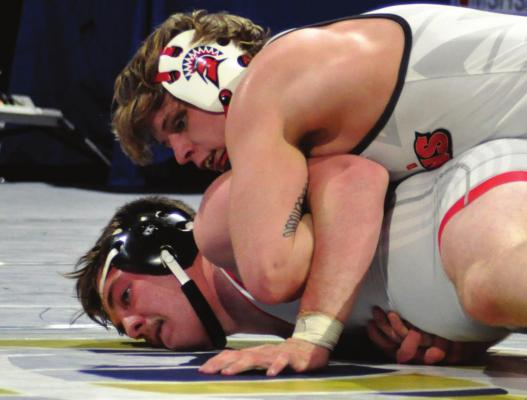 SENIOR RYKER PLYMELL, working from the top position against Maysville’s Blayke Kolb, takes third place in the 195-pound division.