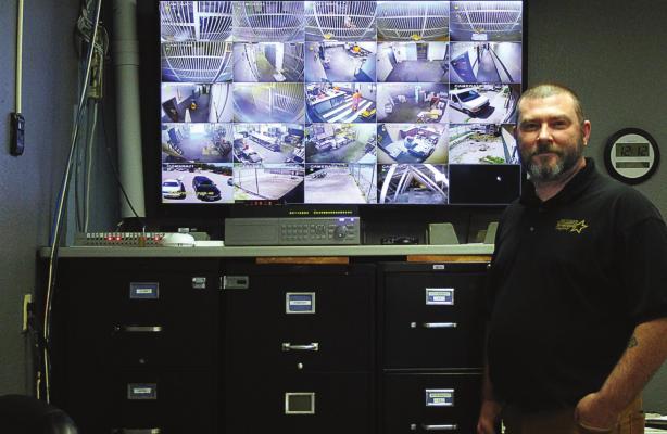 RAY COUNTY JAIL Administrator Chris Clariday discusses the observation room. Cameras show bars for "tanks" where inmates are housed, but the cameras cannot zoom in or move to see much of what inmates do behind the bars.