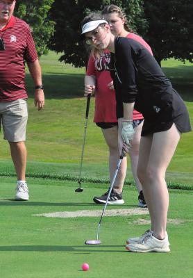 RICHMOND SENIOR and returning Class 1 state qualifier Tori Bowman attempts a long putt during the first day of girls golf practice at Shirkey Golf Course in Richmond. SHAWN RONEY | Staff