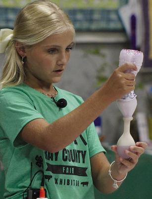 KINSLER HULSEY demonstrates making a glitter stress ball. SHARON DONAT | Staff