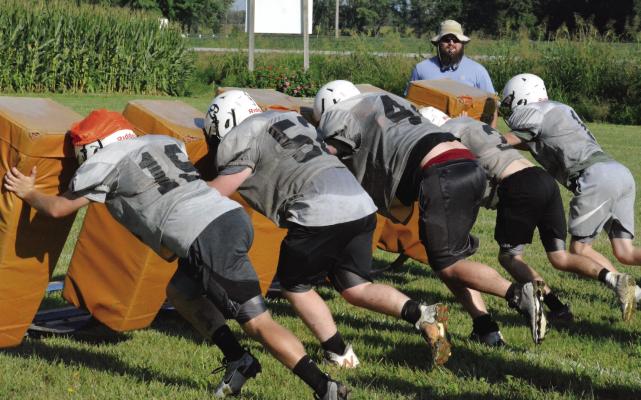THE AGGIES hope the intensity of a recent practice at Hardin-Central, finished off with reps of pushing a blocking sled, will carry over into competitive regular-season performances in varsity 8-man football. SHAWN RONEY | Staff