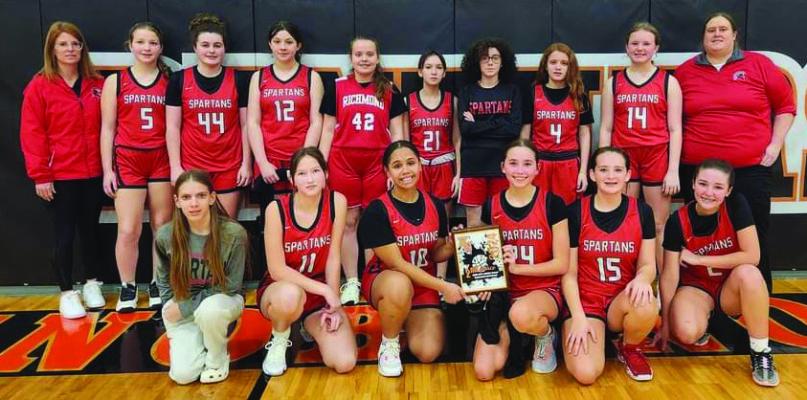 MEMBERS OF THE Richmond Middle School girls basketball program pose after receiving the second-place plaque at an end-of-season tournament at Knob Noster. From left are, front row, Ellison Rennison, Camille Green, Alana Ramos, Brylee Castilleja, Danika Richardson and Adilyn Swope; back row, assistant coach Megan Baker, Madison Shroyer, Olivia McCroskie, Izzy Hash, Zenna Barr, Kaeleigh Damron, Trinity Slater, Jadyn Schmidt, Ava Wilson and head coach Megan Blankenship. ASHLEY DRAISEY | Submitted