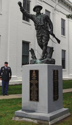 WENTWORTH alumni go to court successfully to preserve alumni ownership of the doughboy statue, which stands on the Lafayette County Courthouse lawn in downtown Lexington. Supporters unveil plaques on the statue pedestal Oct. 2 to identify all Wentworth cadets killed in wars. Among those present at the unveiling, at left, is 1994 Wentworth Military Academy Junior College graduate Loren Duwel. J.C. VENTIMIGLIA | Staff