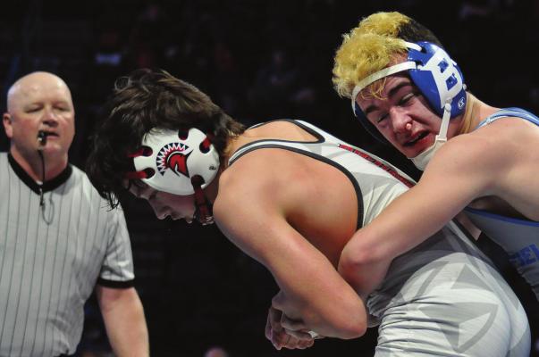 RICHMOND FRESHMAN Elijah Sanders fights to break free from Brookfield’s Colton Parn during an epic fifth-place match in the 132-pound division at the Class 1 state boys wrestling tournament March 11 in Independence. SHAWN RONEY | Staff